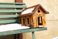 Snowy Bird House on Bench Royalty Free Stock Photo