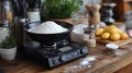 Flour on digital kitchen scale, baking ingredients on wooden counter Royalty Free Stock Photo