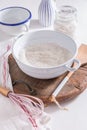Flour and egg with baking ingredients and kitchen utensils Royalty Free Stock Photo