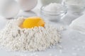 flour, egg yolk, salt, sugar, milk on a white table Royalty Free Stock Photo