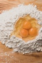 Flour and eggs as ingredients for making pasta dough Royalty Free Stock Photo