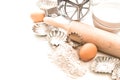 Flour, eggs, rolling pin and cookie cutters. Baking ingredients Royalty Free Stock Photo