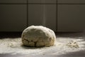 Flour falling on fresh pastry made with original, traditional recipe on the kichen table covered with flour