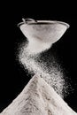 flour falling after sieving on pile