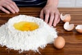 Flour hands eggs raw ingredients Royalty Free Stock Photo