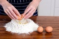 Flour hands eggs raw ingredients Royalty Free Stock Photo