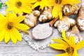 Flour of Jerusalem artichoke in spoon on old board