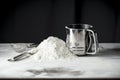 Flour on a kitchen table on a black moody background in the morning light. Space for advertising products.