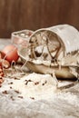 Flour metal bowl with wooden rolling pin on stone table Royalty Free Stock Photo