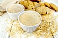 Flour oat in white bowl with bread on board