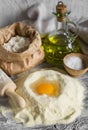 Flour, olive oil, eggs - the ingredients to prepare the dough for pasta Royalty Free Stock Photo