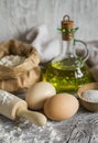 Flour, olive oil, eggs - the ingredients to prepare the dough for pasta Royalty Free Stock Photo