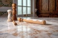 flour and rolling pin on a marble countertop Royalty Free Stock Photo