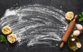 Flour, rolling pin, tomatoes and basil on the table. Pasta cooking process on the kitchen table. Ingredients for making pasta Royalty Free Stock Photo