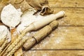 Flour in sacks, ears of grain, spoons and wooden rolling pins Royalty Free Stock Photo
