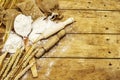 Flour in sacks, ears of grain, spoons and wooden rolling pins