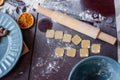 Flour is scattered on wooden Christmas table, gingerbread cookies are being baked. New Years flatlay