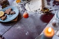 Flour is scattered on wooden Christmas table, gingerbread cookies are being baked. New Years flatlay