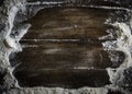 Flour scattered on a wooden table