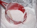 Flour and sieve in bowl Royalty Free Stock Photo