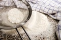 Flour is sieved before baking with a sieve Royalty Free Stock Photo