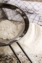 Flour is sieved before baking with a sieve Royalty Free Stock Photo