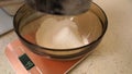 The flour is sifted through a sieve to make the pastry