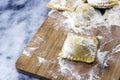 Floured italian ravioli with black pepper