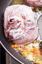 Floured osso buco in pan