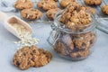 Flourless gluten free peanut butter, oatmeal and chocolate chips cookies in glass jar and on table, horizontal Royalty Free Stock Photo