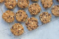 Flourless gluten free peanut butter, oatmeal and chocolate chips cookies on parchment, top view, copy space, horizontal Royalty Free Stock Photo