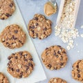 Flourless gluten free peanut butter, oatmeal and chocolate chips cookies on parchment, top view, square