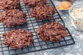 Flourless no bake peanut butter and oatmeal chocolate cookies on cooling rack, horizontal