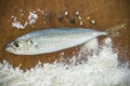 Floury fish on a wooden background Royalty Free Stock Photo