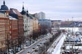 Flow of cars, passenger buses rides along Pohjoisranta street, winter street Helsinki city, yachts and ships stand in northern