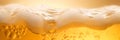 Flow of golden beer with foam and bubbles close up on a bright background Royalty Free Stock Photo