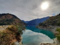 Flow of lake within the mountains chain blue and green water