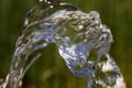 flow of pure spring water on a natural background Royalty Free Stock Photo