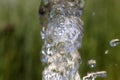 Flow of pure spring water on a natural background Royalty Free Stock Photo