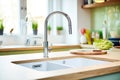 flow restrictors on kitchen taps to reduce water usage