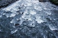 flow of water and spray from a stone close up Royalty Free Stock Photo