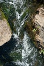 The flow of water between two stones. The view from the top Royalty Free Stock Photo