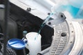 Flow windshield fluid into the windshield washer reservoir Royalty Free Stock Photo
