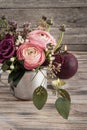 Flower arangement of roses and ranunculus Royalty Free Stock Photo