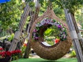 Flower arch for sitting in the garden at coffee shop called `Cafe amatis`, Uttaradit, Thailand