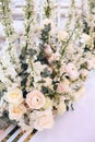 Flower arrangement bouquet of pink roses, ranunculus and white bells and eucalyptus on a white background Royalty Free Stock Photo