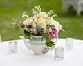 Flower arrangement in old tea pot Royalty Free Stock Photo