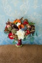 Flower arrangement for a wedding party. The bouquet of flowers on blue wall background. Wedding. Artwork Royalty Free Stock Photo