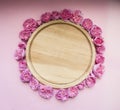 Flower arrangement. A wreath of pink roses on a pink background. Square