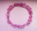 Flower arrangement. A wreath of pink roses on a pink background. Square